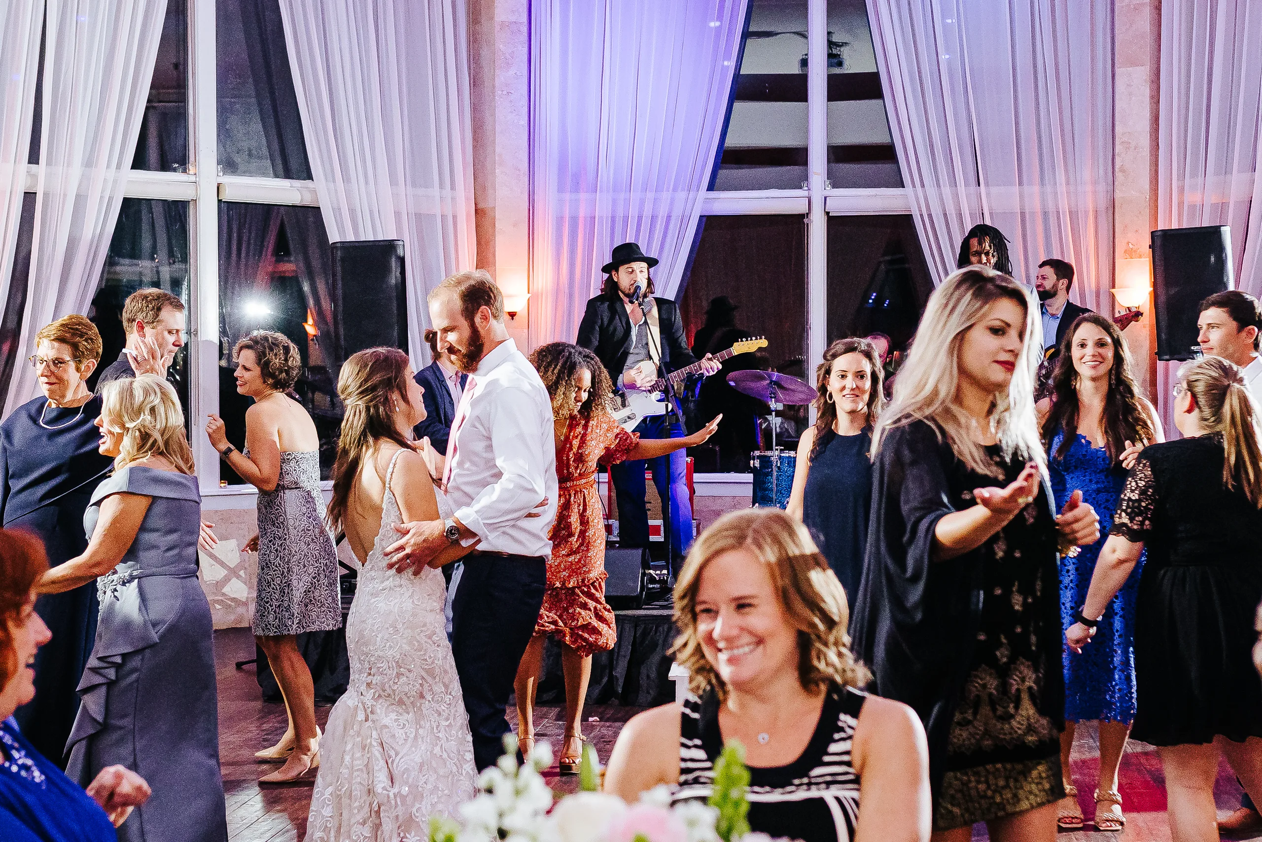 Reception: dancing in front of the band, at their wedding at The Piedmont Room in Atlanta, GA