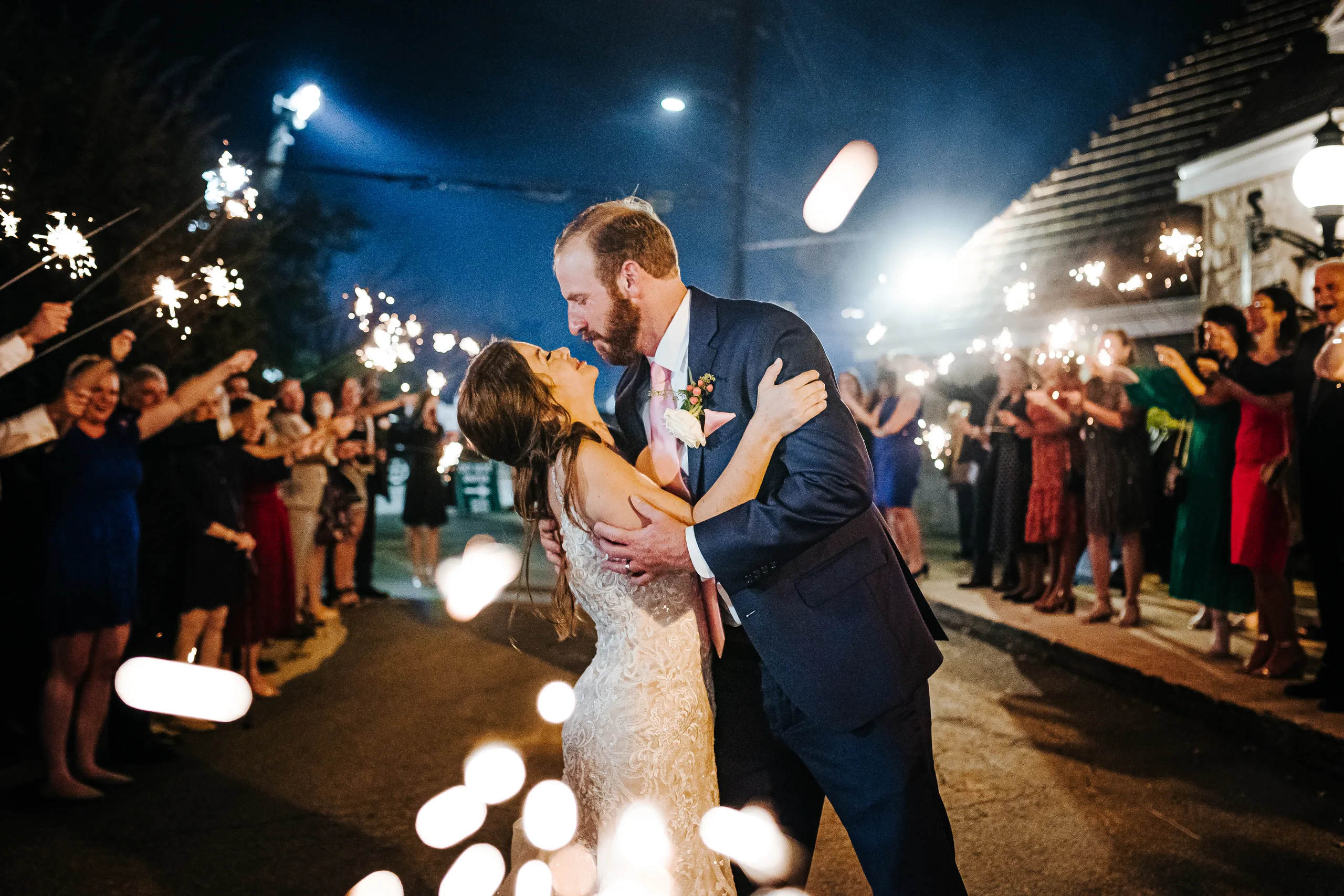 Send-Off: a dip kiss between the sparklers, at their wedding at The Piedmont Room in Atlanta, GA