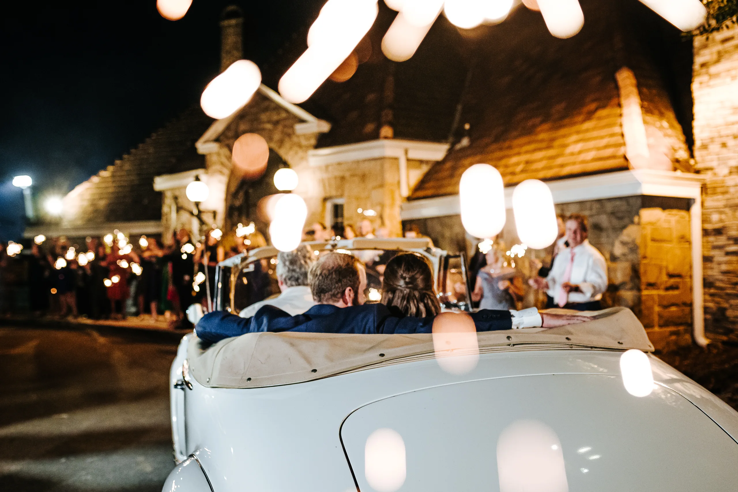 Send-Off: driving off in the vintage Packard convertible, at their wedding at The Piedmont Room in Atlanta, GA