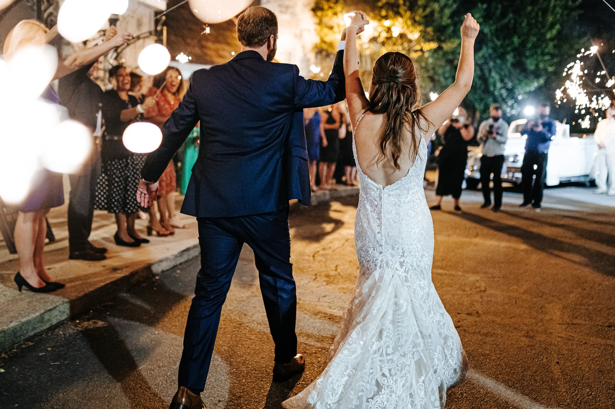 Send-Off: cheering through the sparklers toward the car, at their wedding at The Piedmont Room in Atlanta, GA
