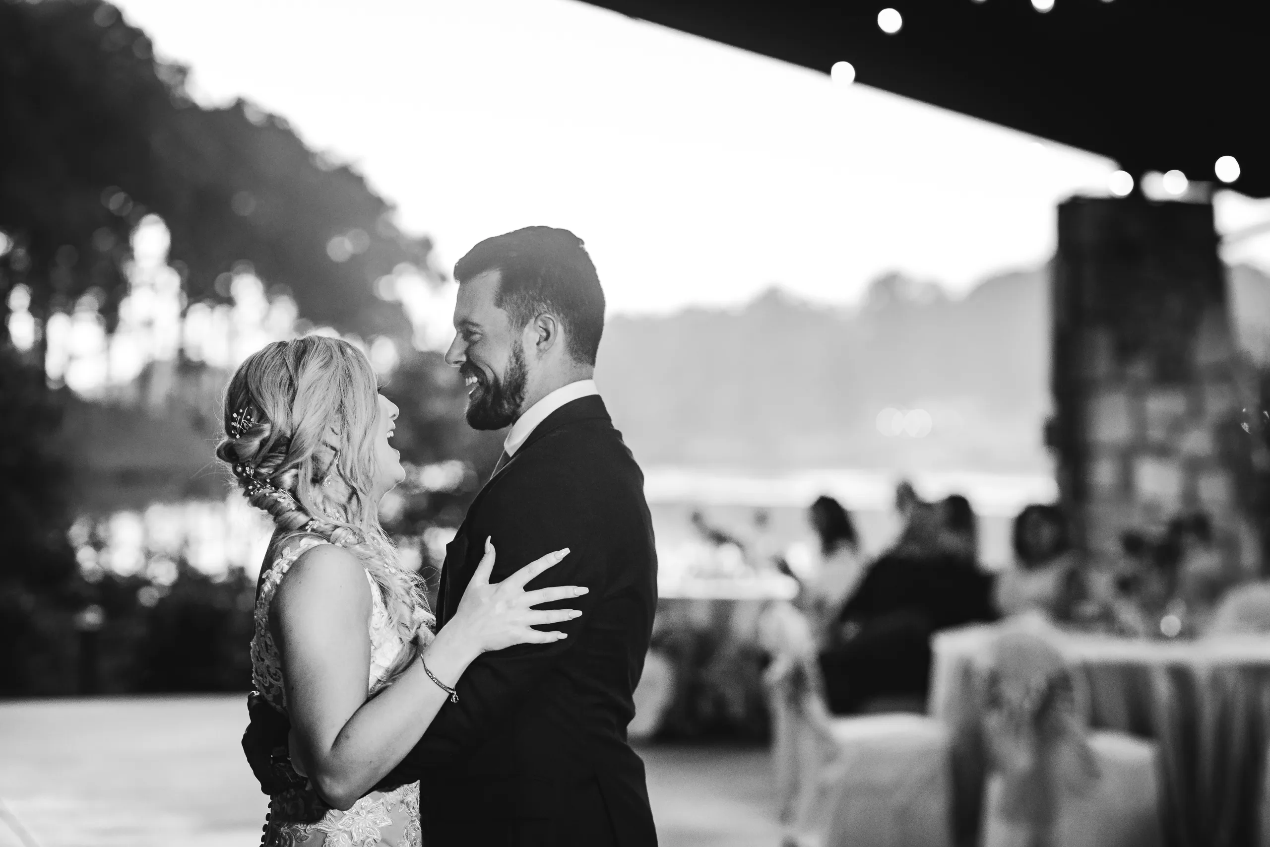 First Dance: their first dance with the lake behind them, in black and white, at their wedding at Atlanta Evergreen Lakeside Resort in Stone Mountain, GA