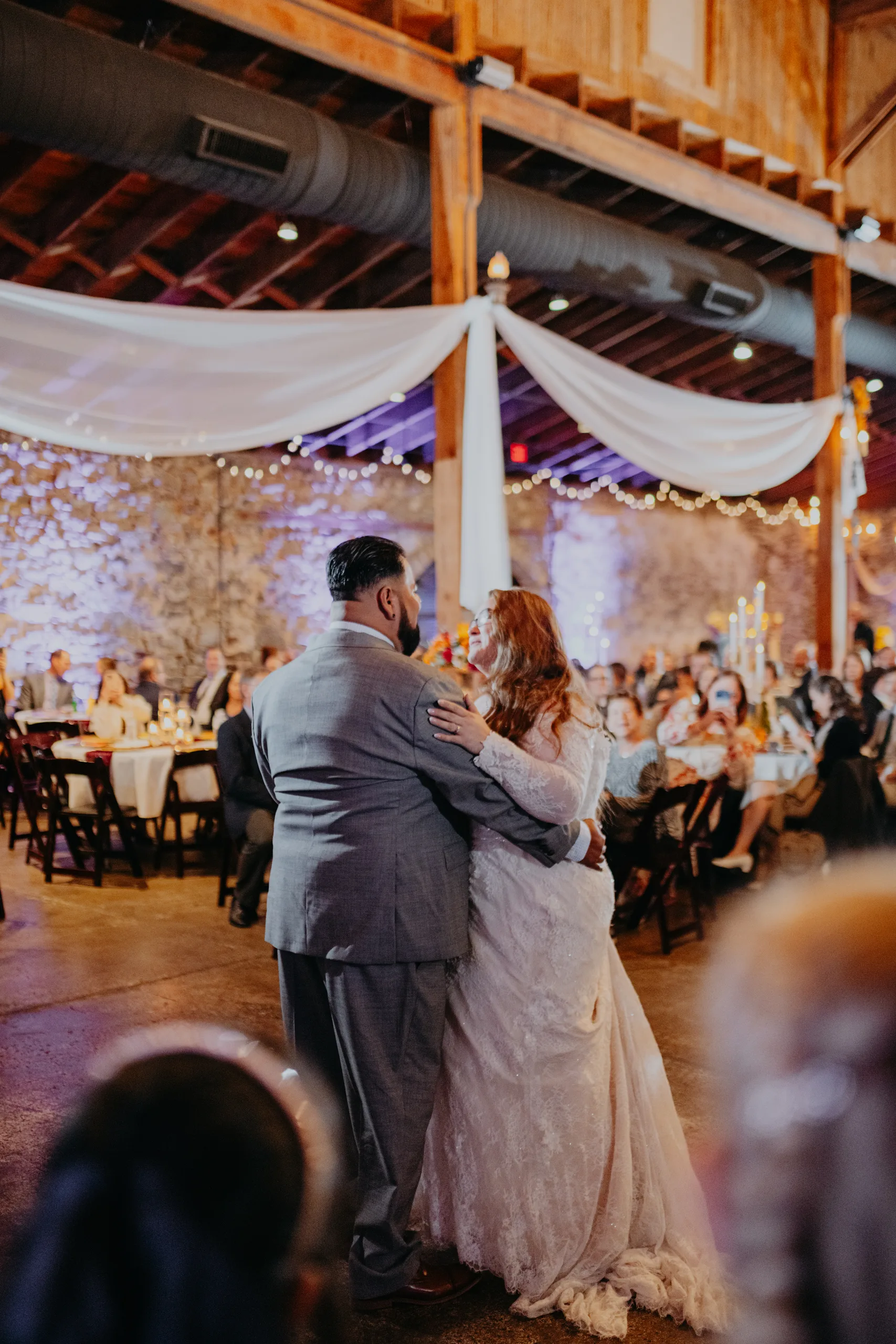 First Dance: their first dance under the draped ceiling, at their wedding at 550 Trackside in Lawrenceville, GA
