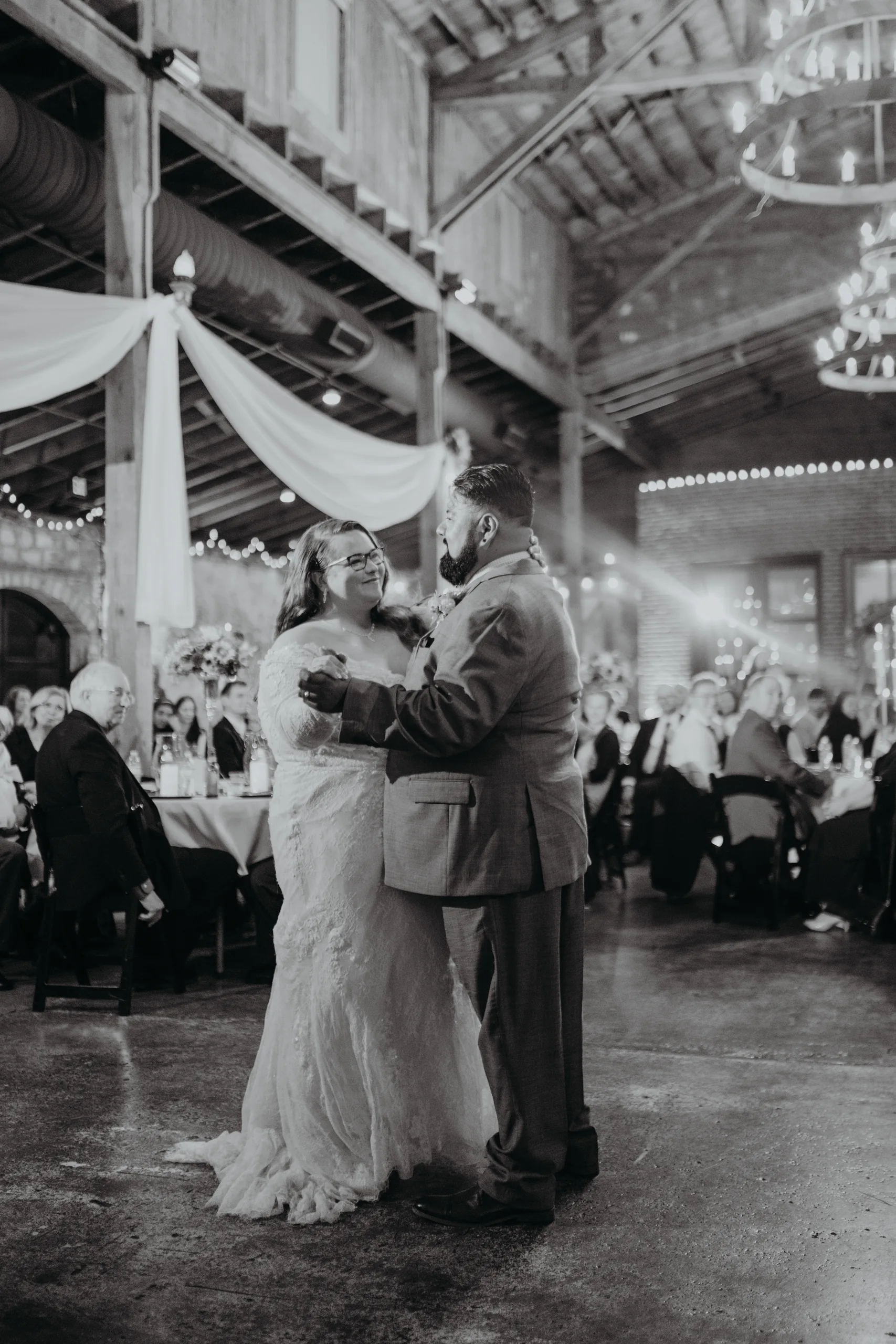 First Dance: the first dance, in black and white, at their wedding at 550 Trackside in Lawrenceville, GA