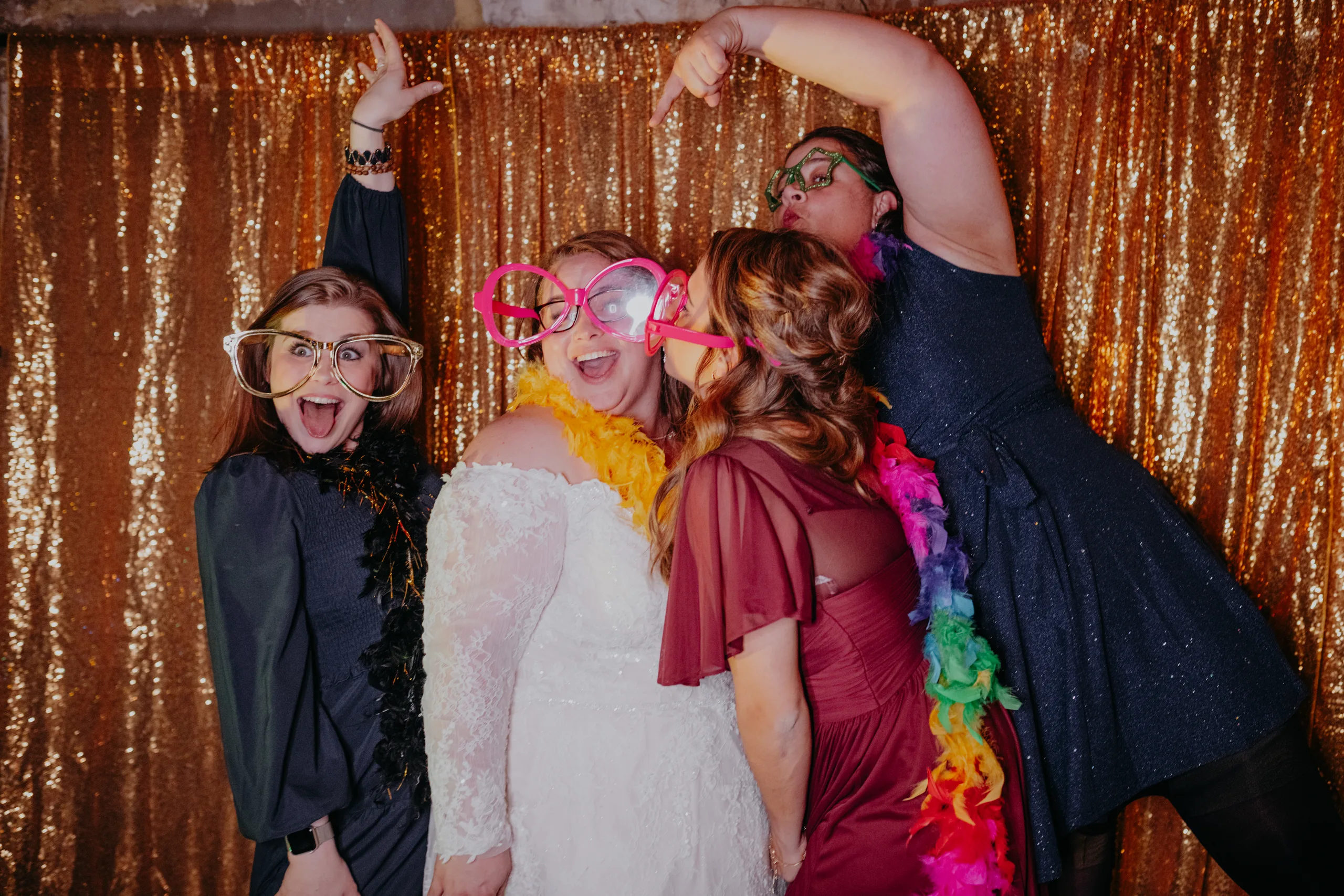 Reception: the bride and her friends in the photo booth, at their wedding at 550 Trackside in Lawrenceville, GA