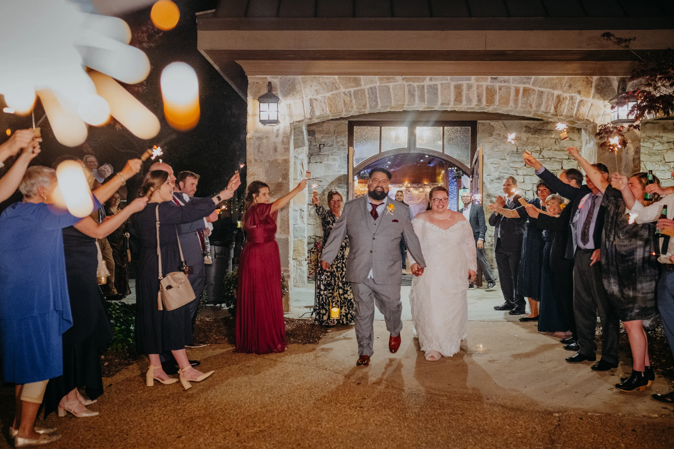 Send-Off: walking out through the sparklers, at their wedding at 550 Trackside in Lawrenceville, GA