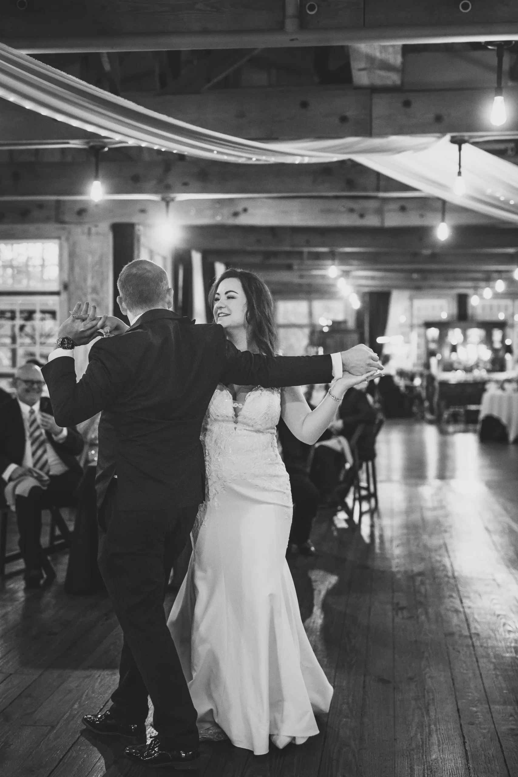 First Dance: their first dance, in black and white at their wedding at Ivy Hall at Roswell Mill in Roswell, GA