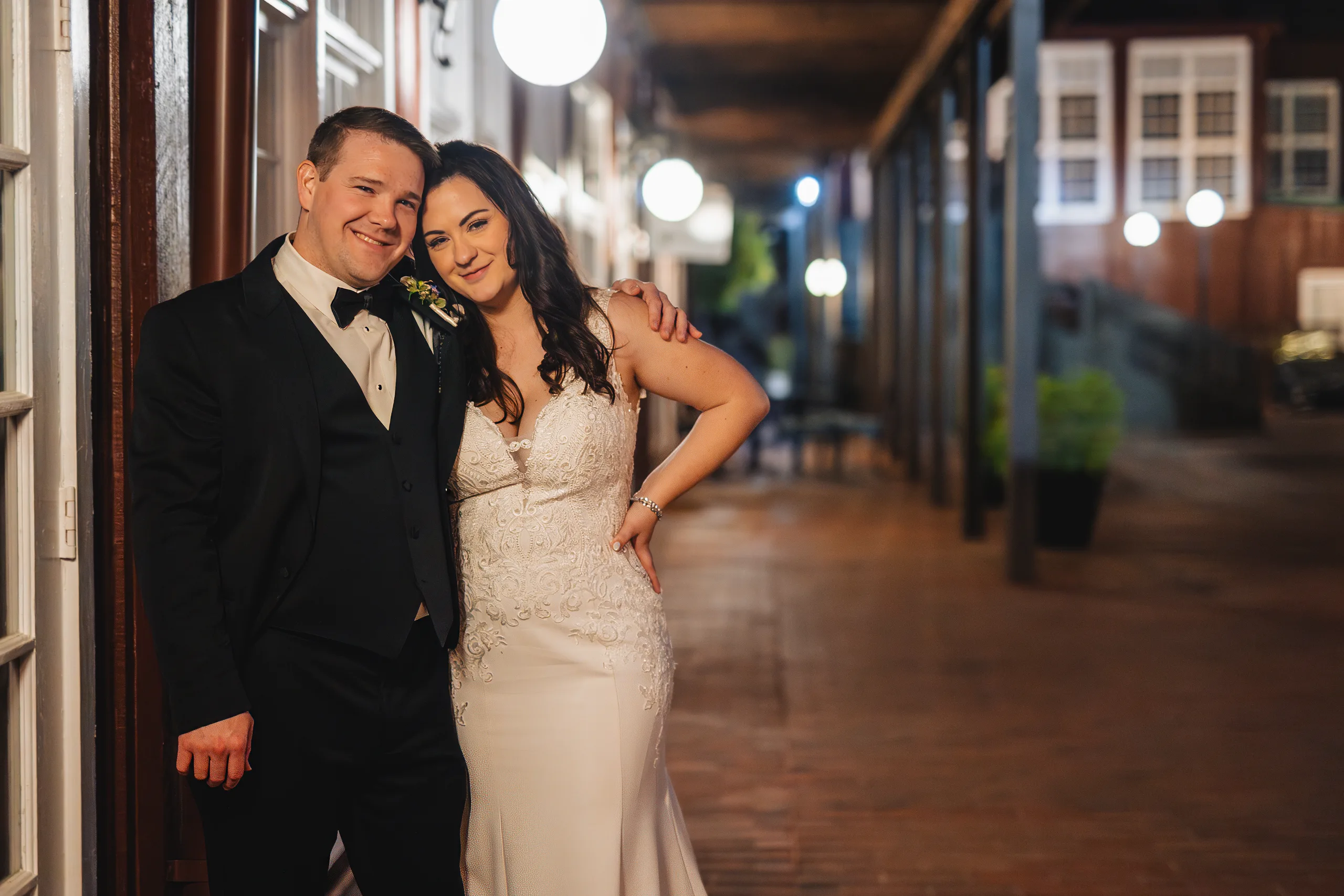 Wedding Formals: the two of them on the mill walkway at night at their wedding at Ivy Hall at Roswell Mill in Roswell, GA