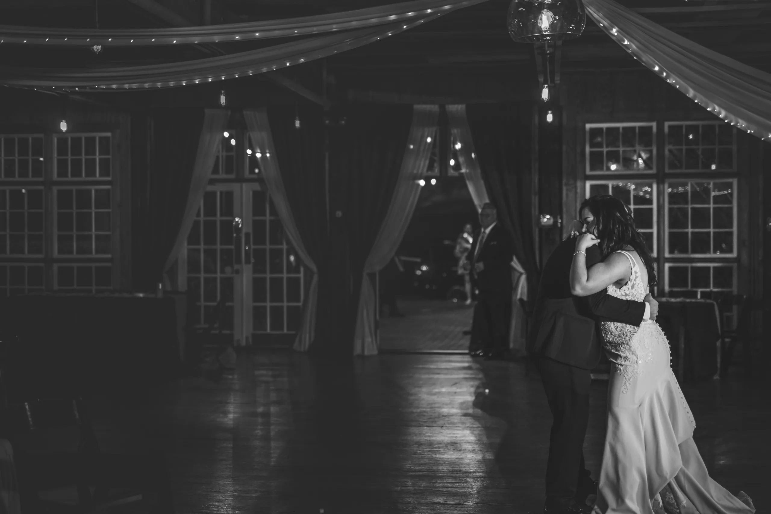 Reception: their last dance in the dark, in black and white at their wedding at Ivy Hall at Roswell Mill in Roswell, GA