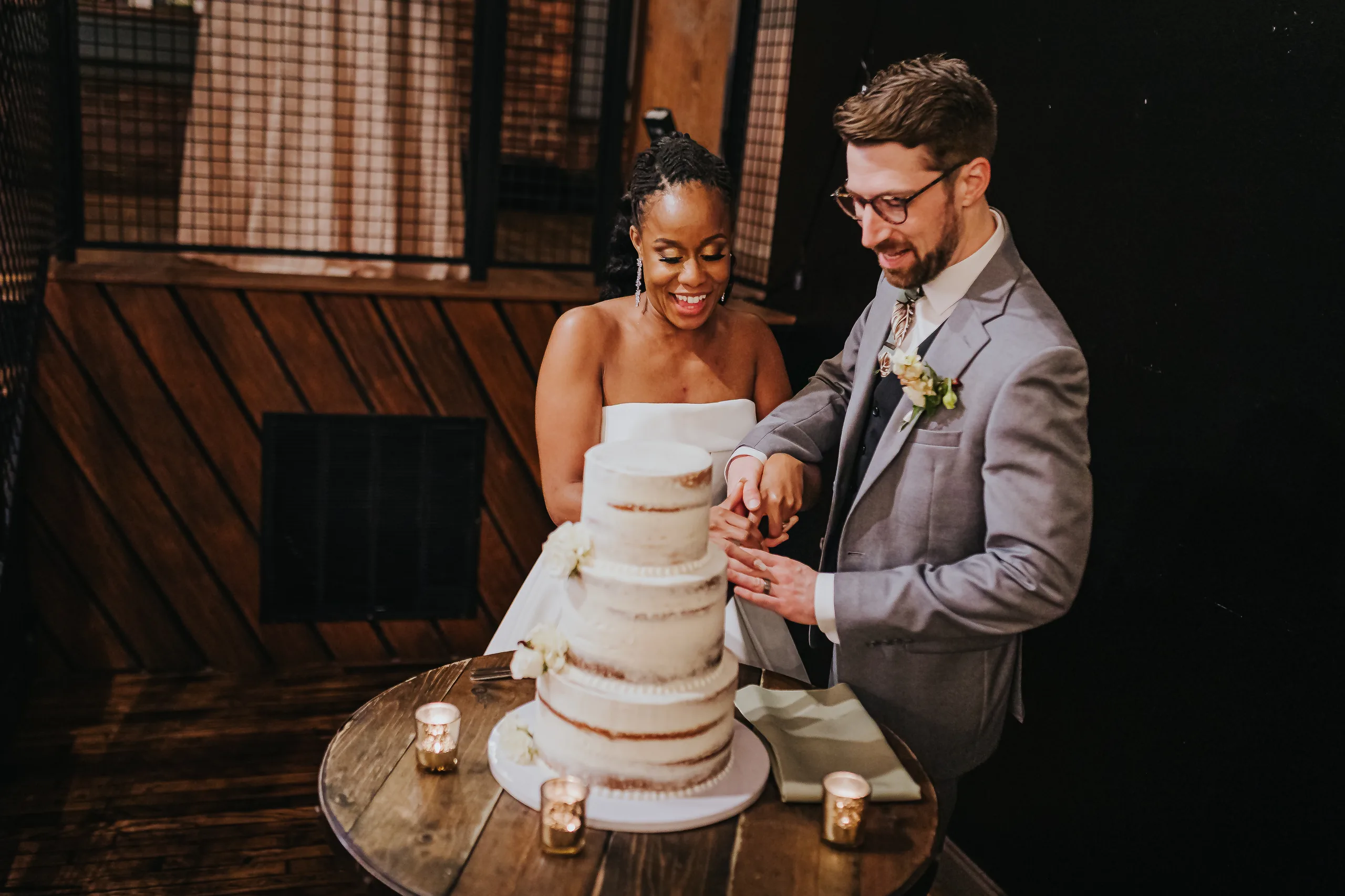Reception: cutting the cake together, at their wedding at Terminus 330 in Atlanta, GA