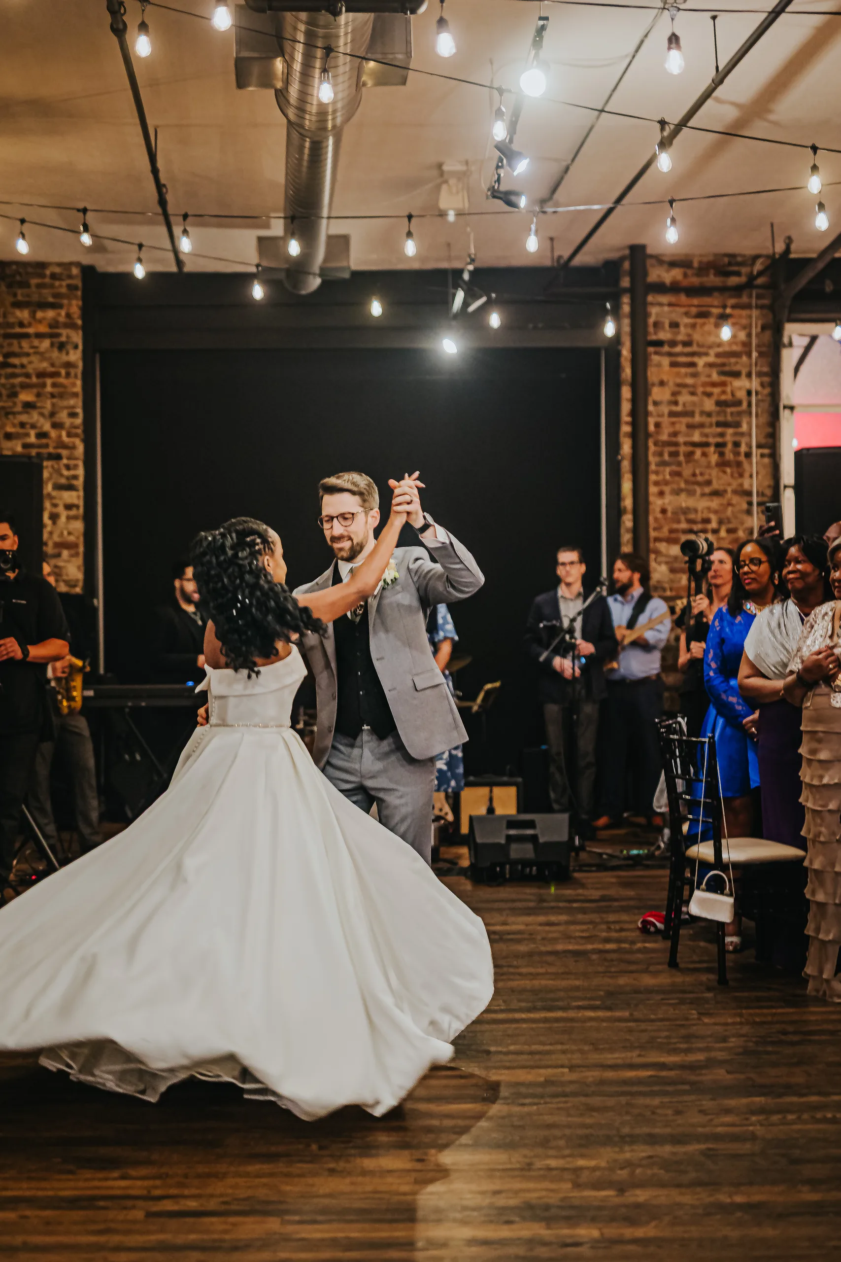 First Dance: a twirl during their first dance, at their wedding at Terminus 330 in Atlanta, GA