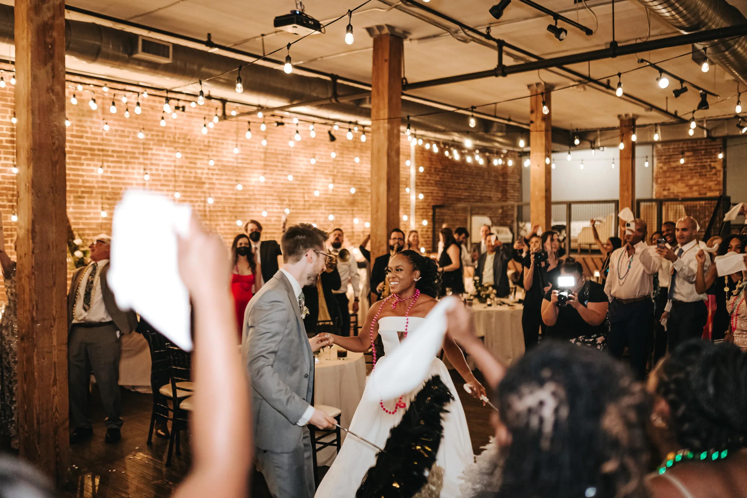 Reception: waving handkerchiefs in the second line, at their wedding at Terminus 330 in Atlanta, GA