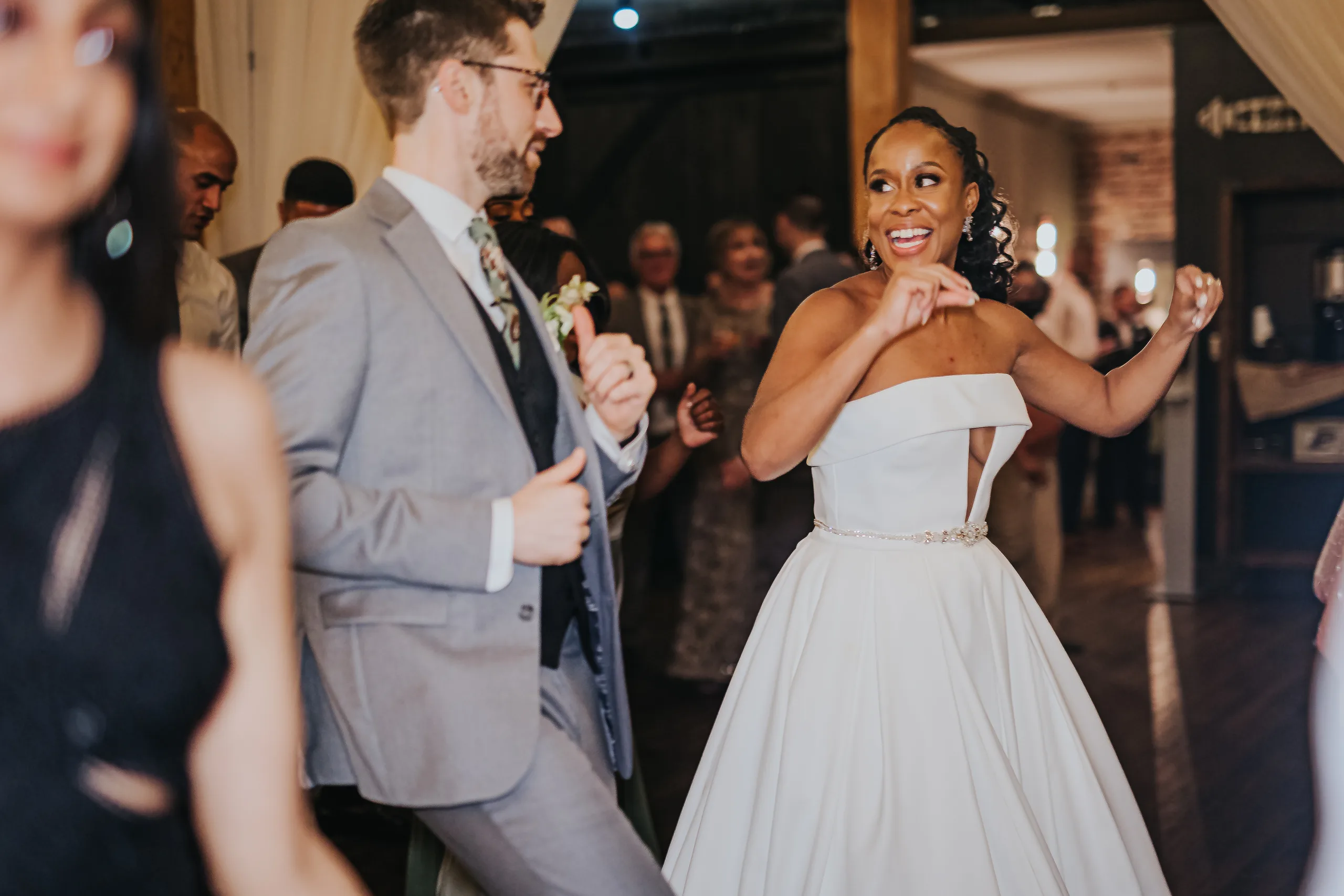Reception: the bride dancing with the groom, at their wedding at Terminus 330 in Atlanta, GA